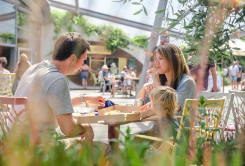 Family enjoying pizza in an Eden Project café